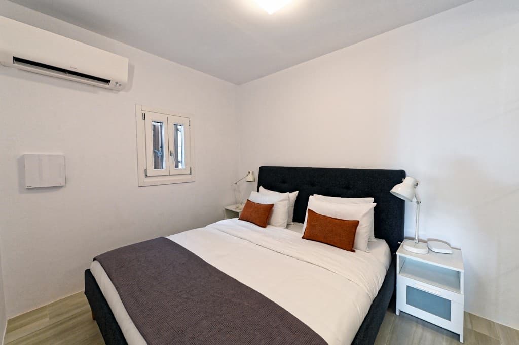 Bedroom with premium bedding at Hedoni Mykonos
