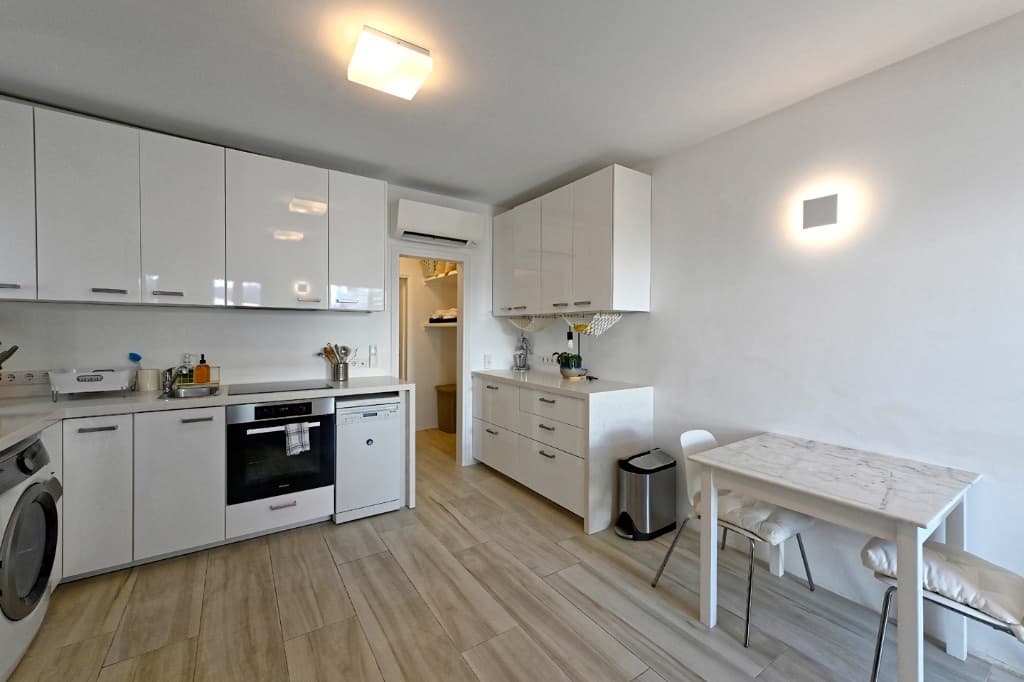 Kitchen, dining table and living space at Hedoni Mykonos