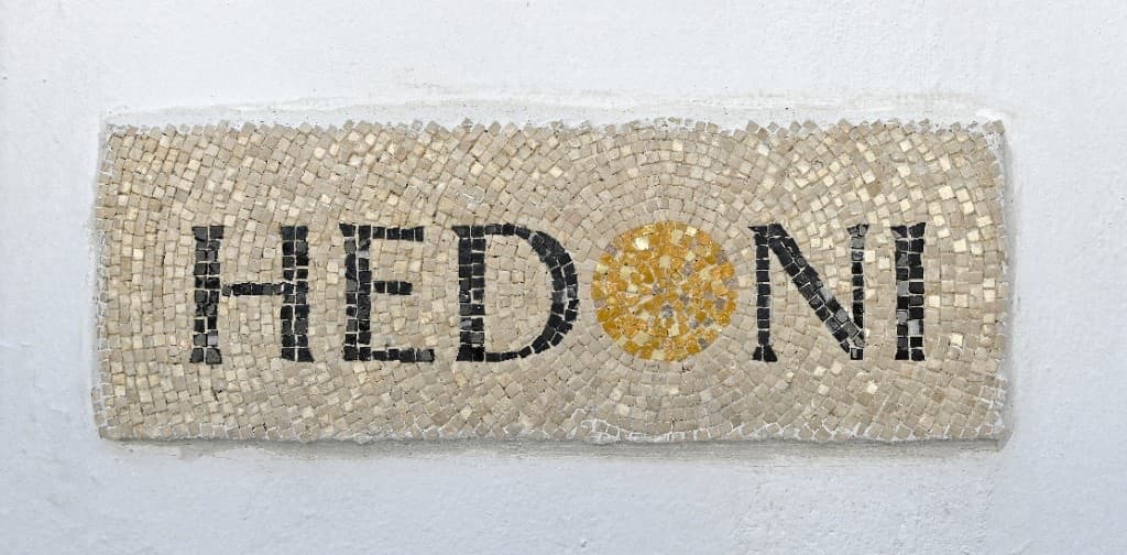 Hedoni mosaic sign at the entrance in Mykonos Town